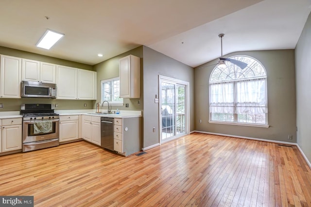 kitchen featuring sink, white cabinetry, and stainless steel appliances