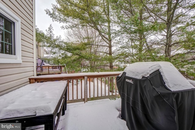 wooden deck featuring area for grilling