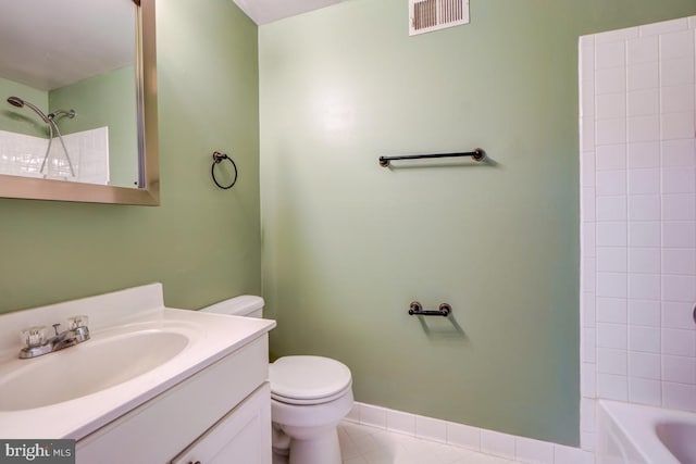 full bathroom featuring tile patterned floors, vanity,  shower combination, and toilet