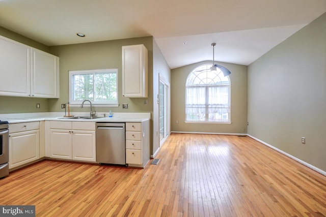 kitchen featuring white cabinetry, dishwasher, pendant lighting, and sink