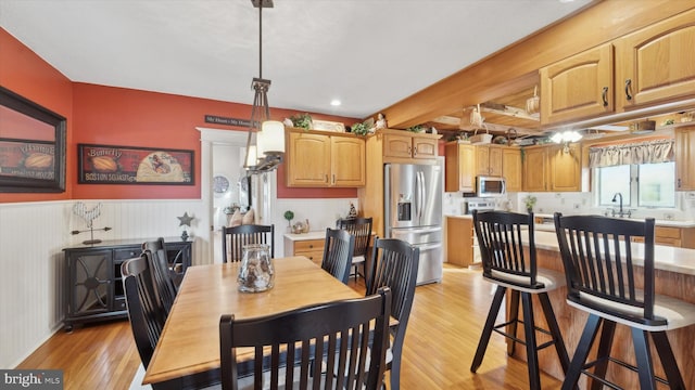 dining space featuring light hardwood / wood-style flooring