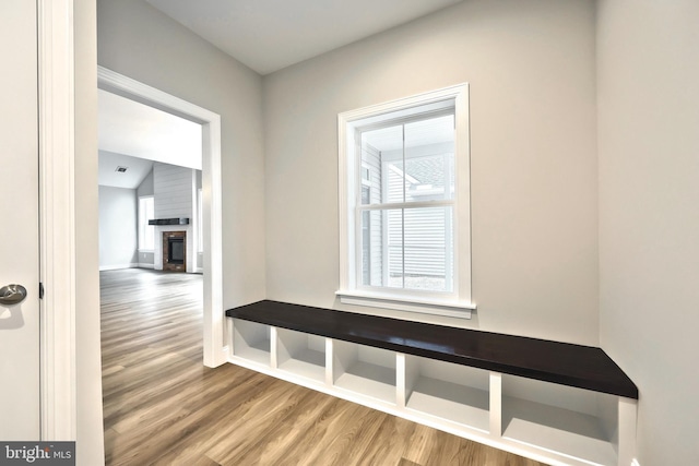 mudroom featuring hardwood / wood-style flooring and vaulted ceiling