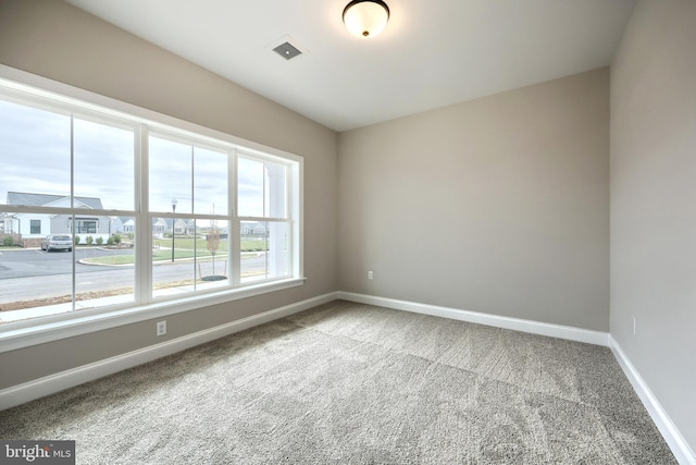 unfurnished room with carpet