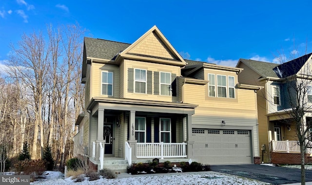 view of front of property featuring a porch and a garage