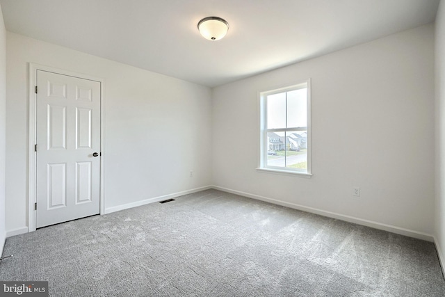 view of carpeted spare room