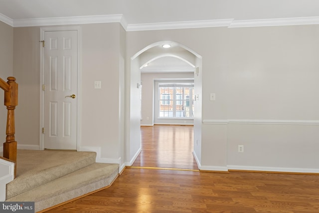 hall featuring crown molding and hardwood / wood-style floors