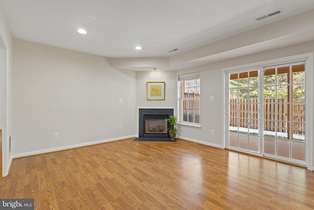 unfurnished living room featuring light wood-type flooring