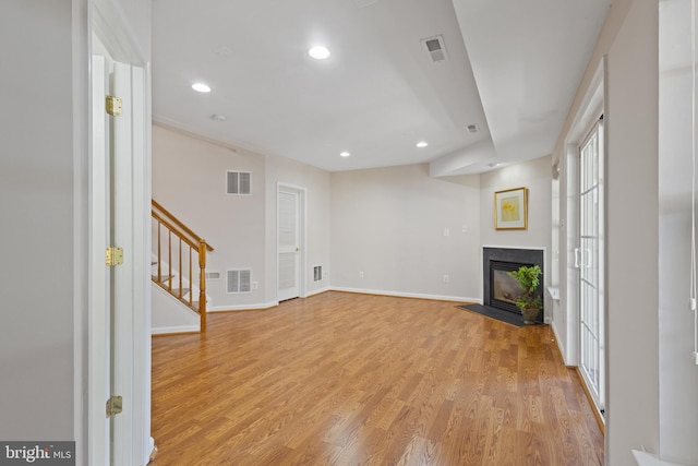 unfurnished living room with light hardwood / wood-style floors