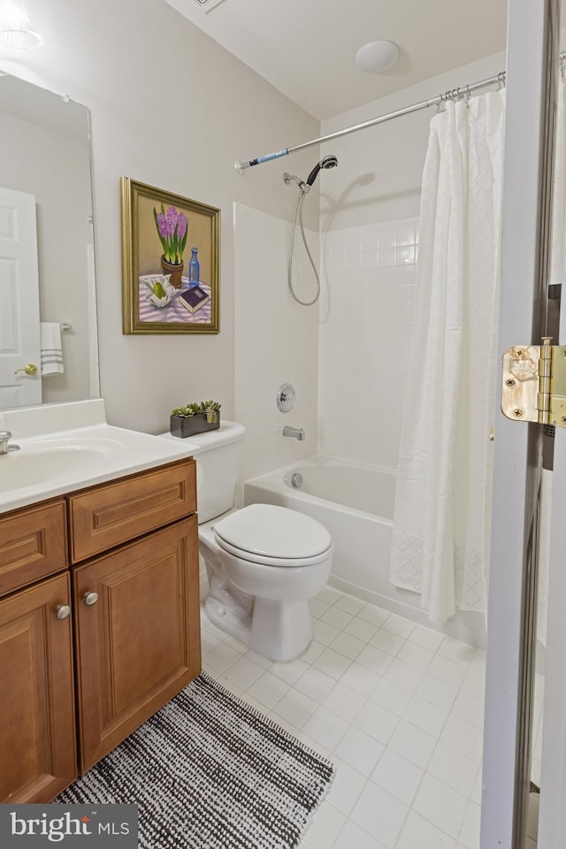 full bathroom with toilet, vanity, tile patterned floors, and shower / tub combo with curtain