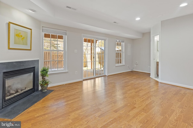 unfurnished living room with light wood-type flooring