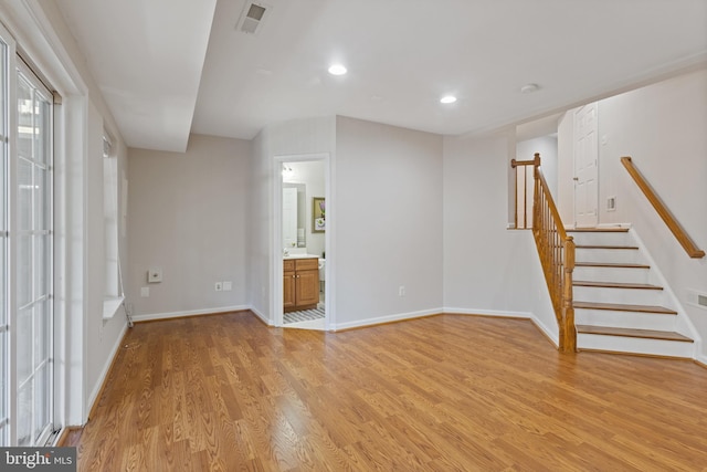 unfurnished living room with light hardwood / wood-style floors