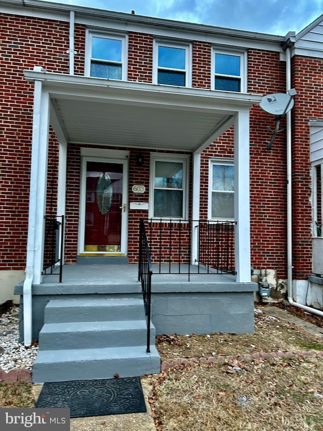 doorway to property with a porch