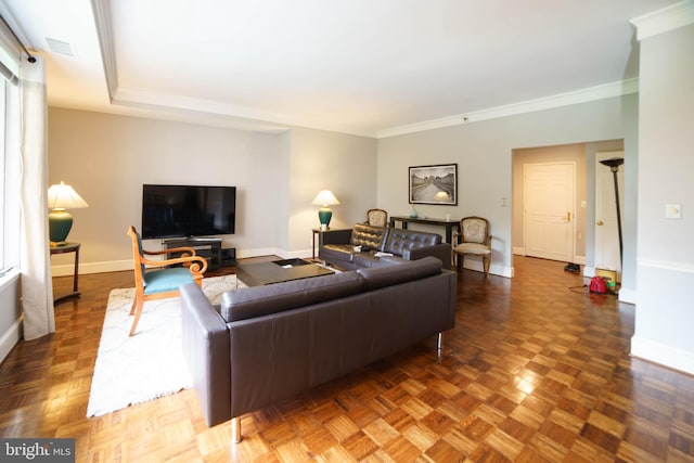 living room featuring dark parquet floors and crown molding