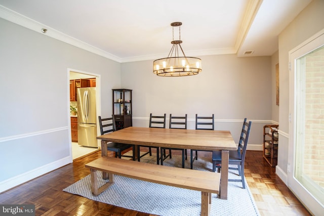 dining space featuring a notable chandelier, parquet floors, and ornamental molding