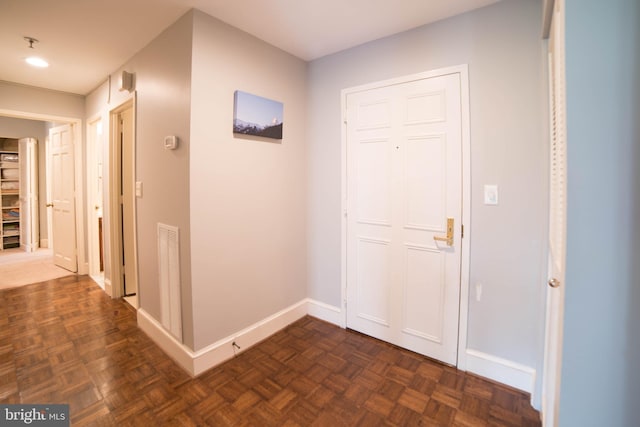 interior space with dark parquet floors