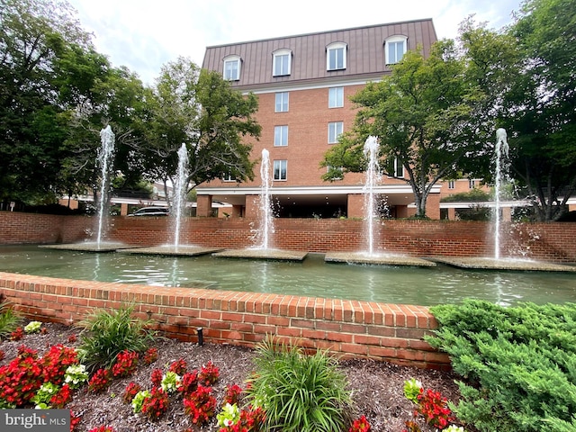 surrounding community featuring a water view