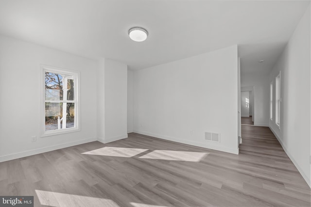 spare room with light hardwood / wood-style flooring