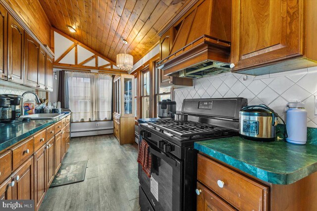 kitchen with light wood-type flooring, black range with gas cooktop, sink, wooden ceiling, and lofted ceiling