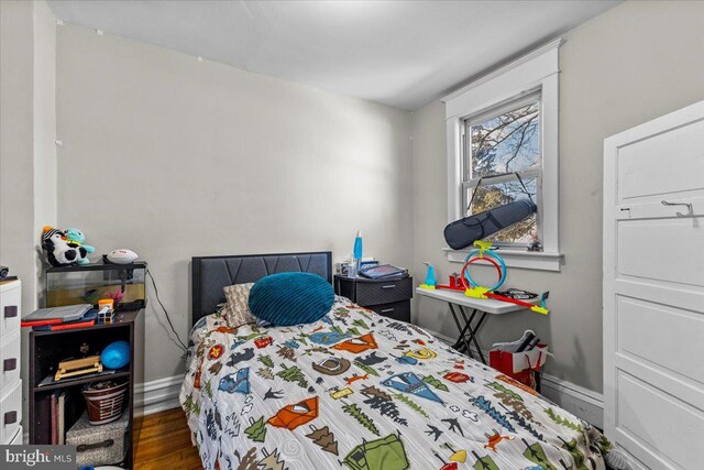 bedroom featuring dark wood-type flooring