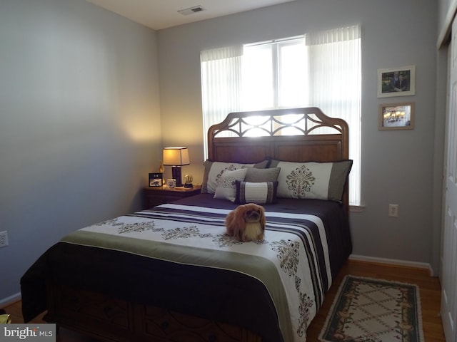 bedroom featuring hardwood / wood-style floors