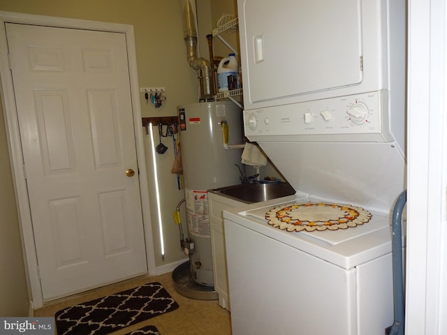 laundry room featuring water heater and stacked washer and clothes dryer