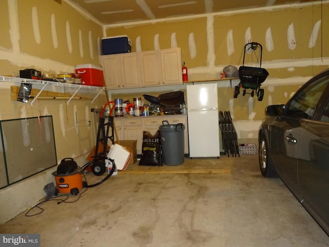 garage with white refrigerator