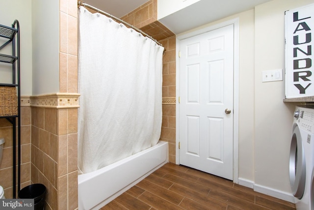 bathroom with washer / clothes dryer and shower / bath combo