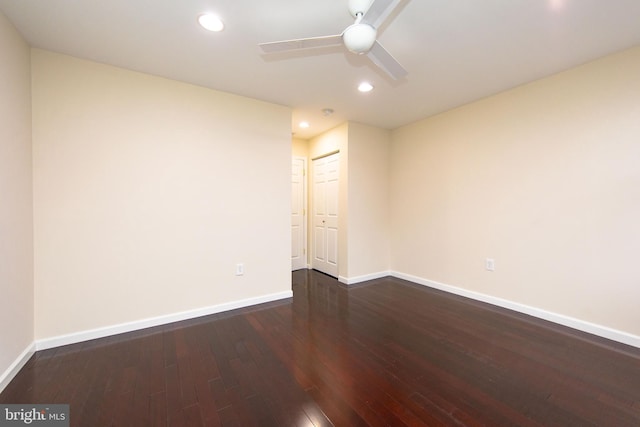 unfurnished room featuring ceiling fan and dark hardwood / wood-style flooring