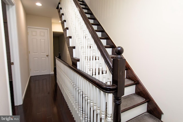 stairs with hardwood / wood-style floors