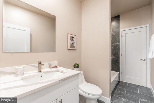 full bathroom featuring vanity, toilet, and tiled shower / bath