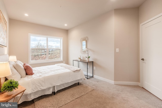 bedroom with light colored carpet