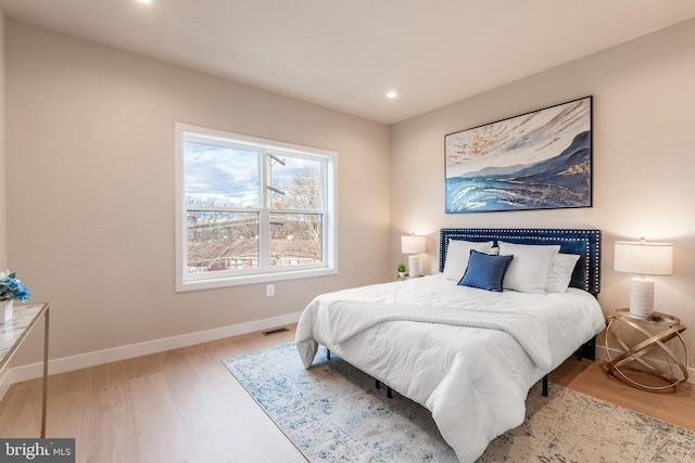 bedroom with light wood-type flooring