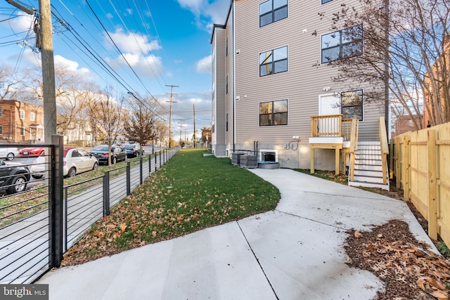 view of property exterior with a yard