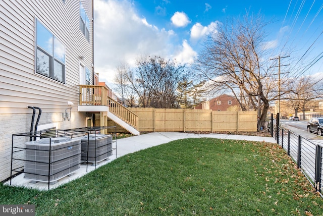 view of yard with central AC