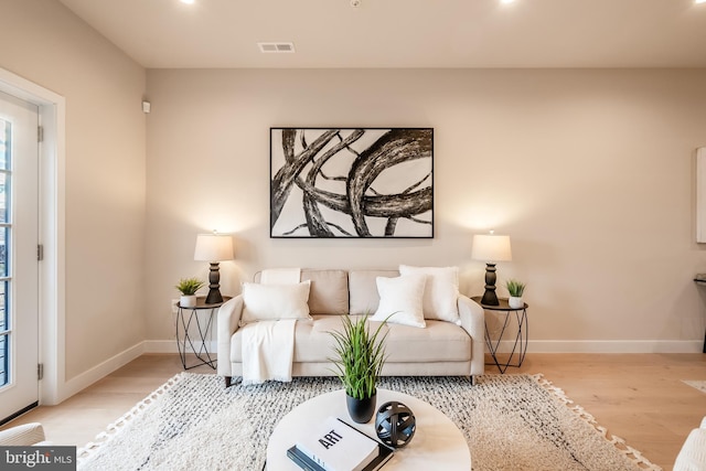 living room with light hardwood / wood-style flooring