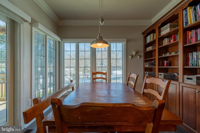 dining room featuring crown molding