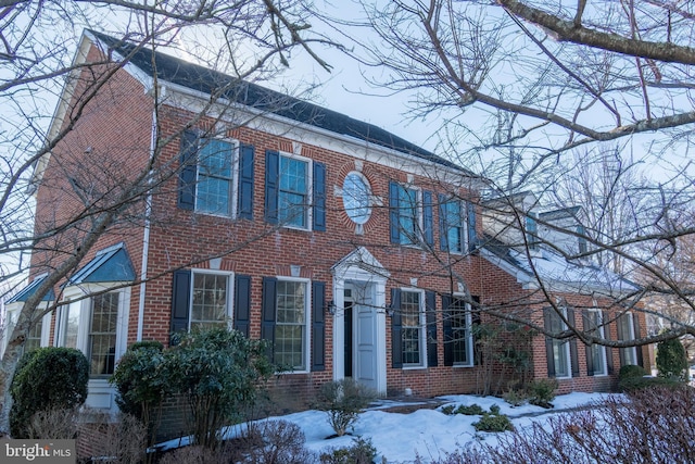 colonial house with brick siding