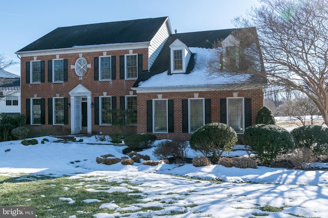 view of front facade featuring brick siding