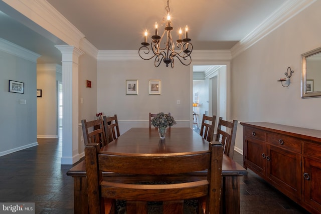 dining space with ornamental molding, dark hardwood / wood-style floors, a chandelier, and decorative columns