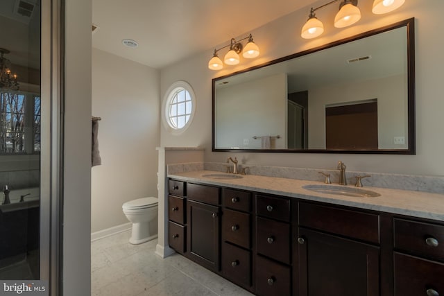 bathroom with vanity and toilet