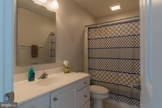 bathroom featuring tile patterned flooring, vanity, a shower with shower curtain, and toilet