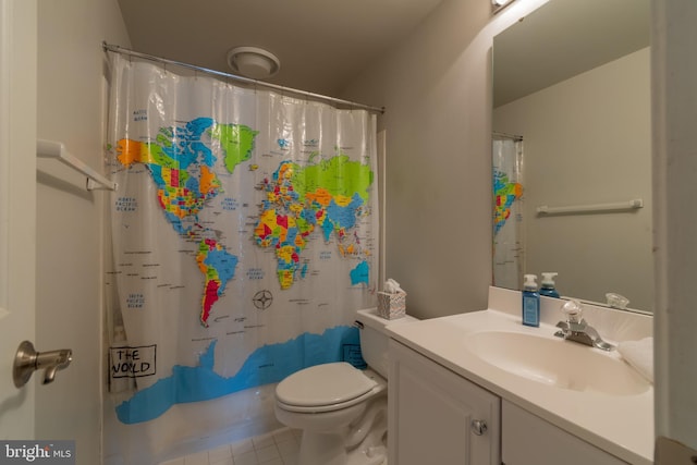 bathroom featuring tile patterned floors, toilet, and vanity