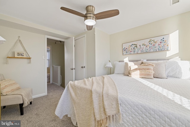 bedroom with light colored carpet, a closet, and ceiling fan