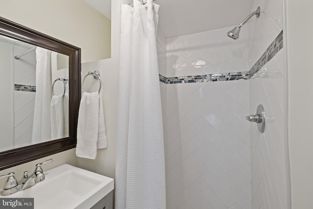 bathroom with a shower with curtain and sink