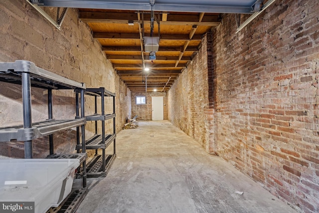 basement with brick wall