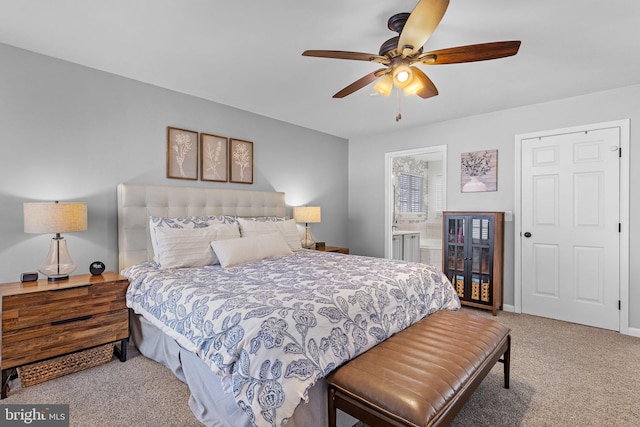 bedroom featuring carpet flooring, connected bathroom, and ceiling fan