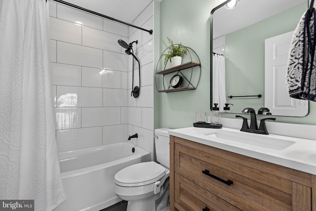 full bathroom with vanity, shower / bath combo, and toilet