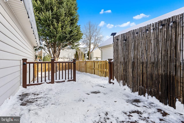 view of yard layered in snow