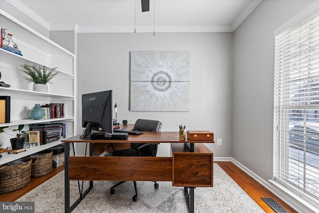 office featuring light hardwood / wood-style flooring and ornamental molding