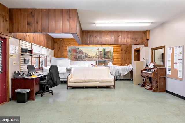 bedroom featuring wood walls